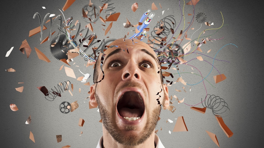 Image of frustrated man with colorful confetti coming out of his head.